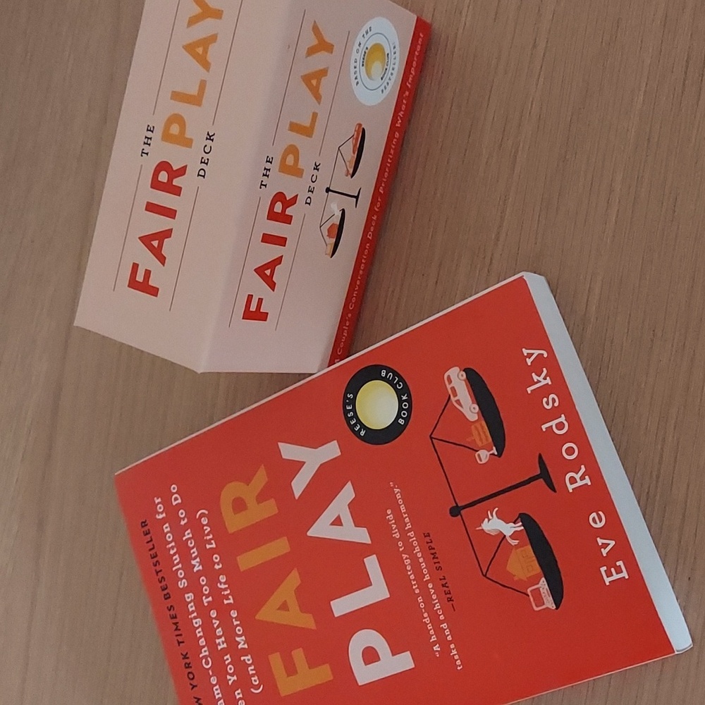 A brand new fair play book and card deck set